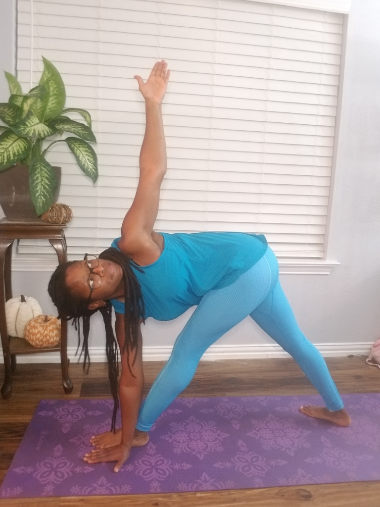 Young Woman Demonstrates Revolved Side Angle Yoga Pose Stock Photo -  Download Image Now - iStock