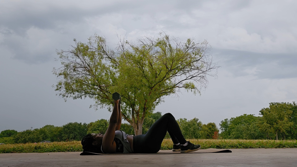 woman performing upper body workout