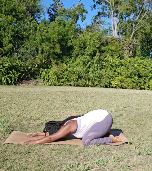 african american woman doing child's pose yoga for relaxation