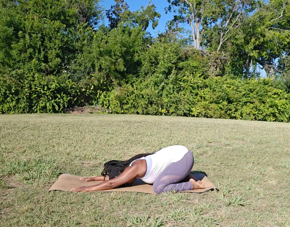 african american woman doing child's pose yoga for relaxation