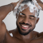 african american man shampoo hair