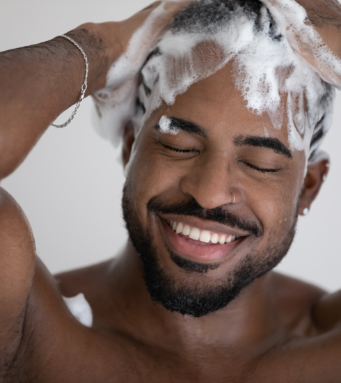 african american man shampoo hair